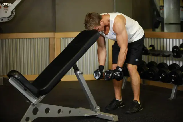 Bent Over Dumbbell Rear Delt Raise With Head On Bench 1
