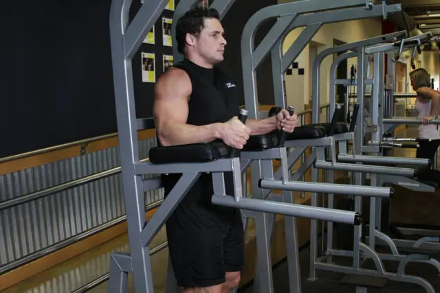 Knee/Hip Raise On Parallel Bars — Start