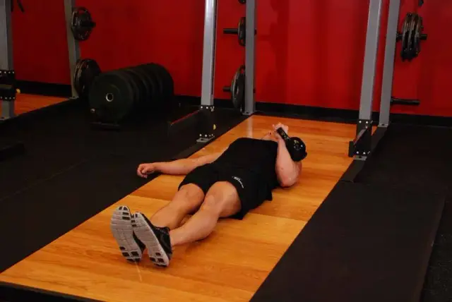 One-Arm Kettlebell Floor Press — Start