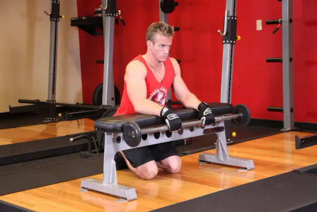 Palms-Down Wrist Curl Over A Bench 1