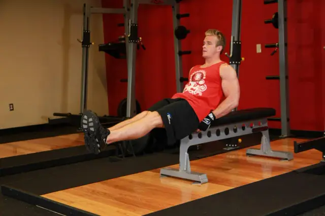 Seated Flat Bench Leg Pull-In — Start