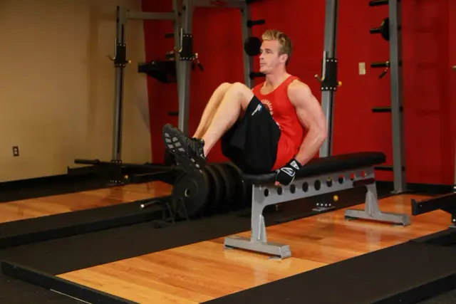 Seated Flat Bench Leg Pull-In — End