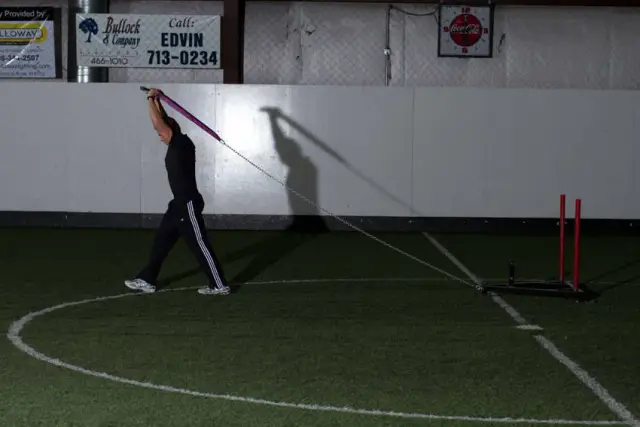 Sled Overhead Triceps Extension — End