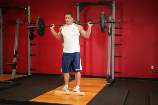 Standing Barbell Calf Raise — End