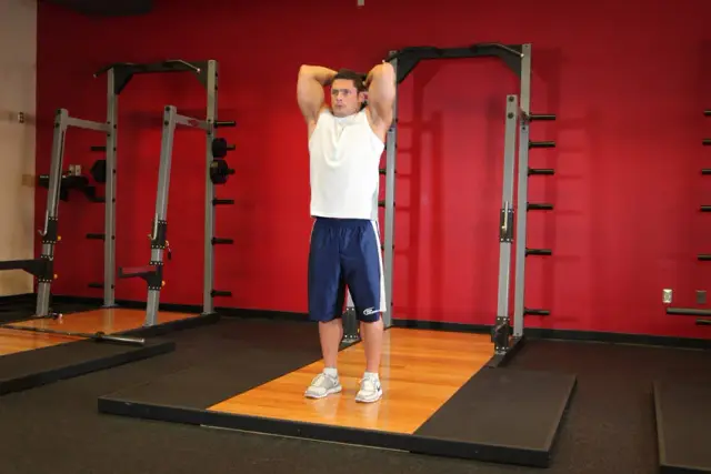 Standing Dumbbell Triceps Extension — End