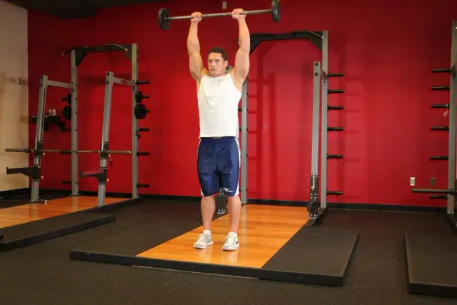 Standing Front Barbell Raise Over Head — End