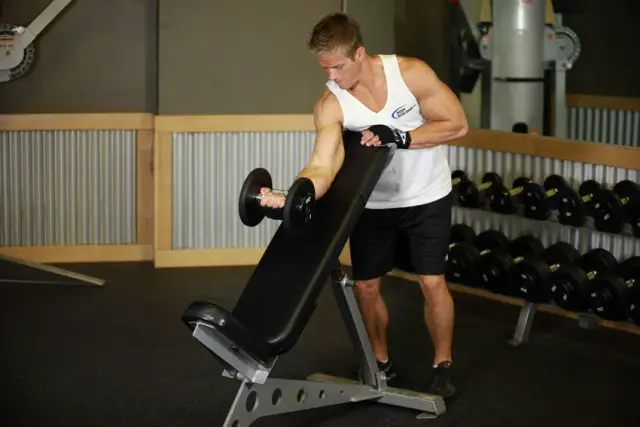 Standing One-Arm Dumbbell Curl Over Incline Bench 1