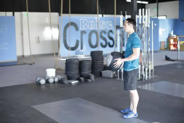 Standing Two-Arm Overhead Throw — Start