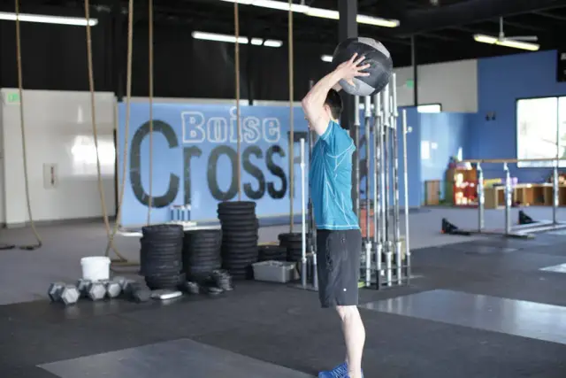 Standing Two-Arm Overhead Throw — End